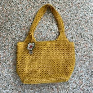 The Sak yellow woven hobo 120 bag with flower
